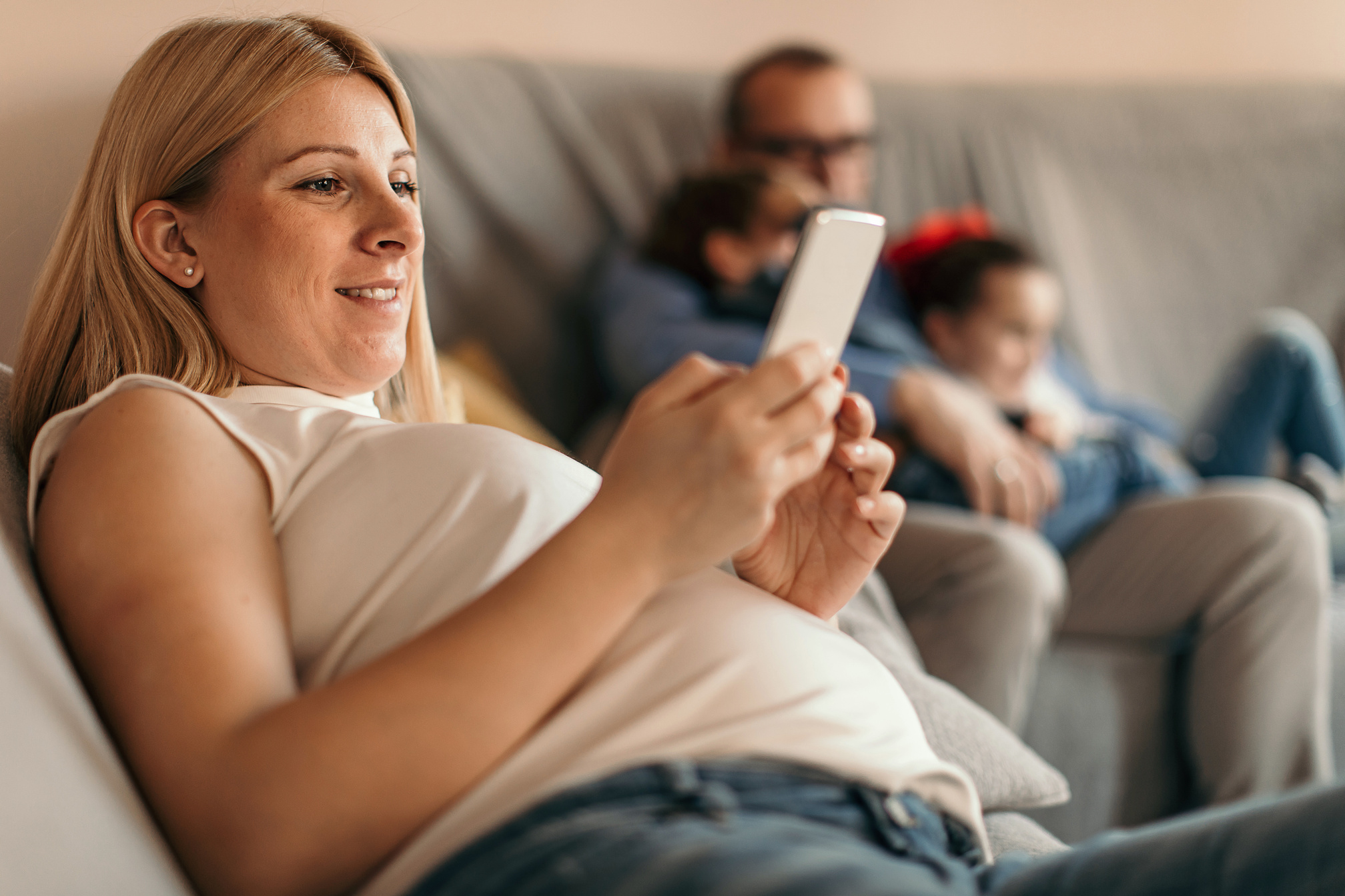Pregnant mom using cell phone